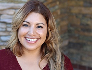 Woman with beautiful smile smiling outside