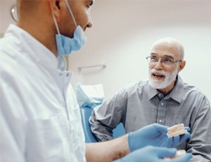 a person smiling with a missing tooth