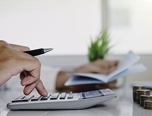 Man using a calculator