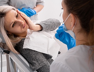 patient visiting dentist to prevent dental emergencies in Harrisburg