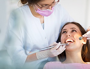 woman undergoing checkup to prevent dental emergencies in Harrisburg