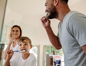 family brushing teeth to prevent dental emergencies in Harrisburg