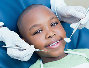 Young boy smiling in dental chair