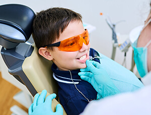 Young boy receives fluoride treatment