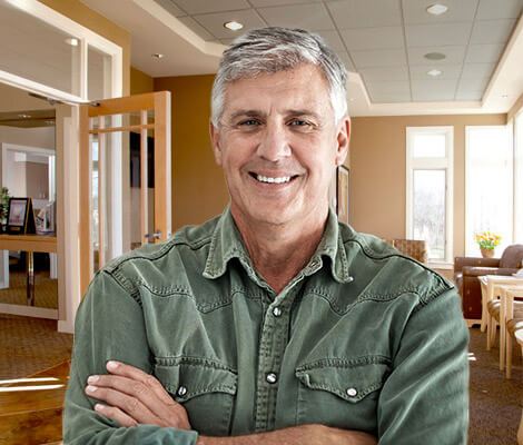 Smiling male patient in dental waiting room