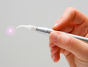 Soft tissue laser wand with glowing tip
