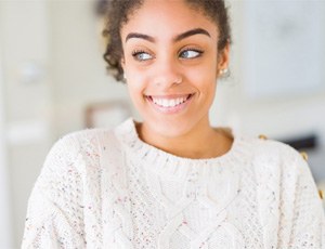 : a woman smiling after undergoing teeth whitening in Harrisburg