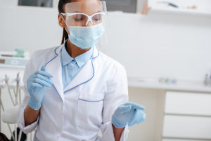 A dentist in Harrisburg wears a face mask.