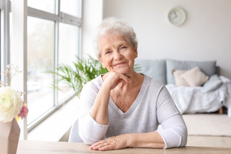 senior smiling at the camera